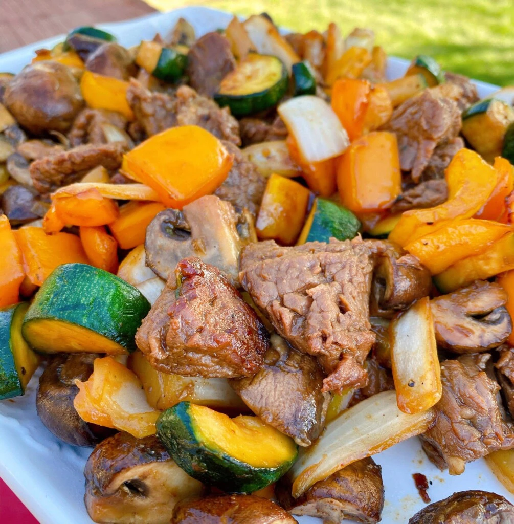 Grilled Teriyaki Steak and Vegetable Stir Fry on a serving platter.