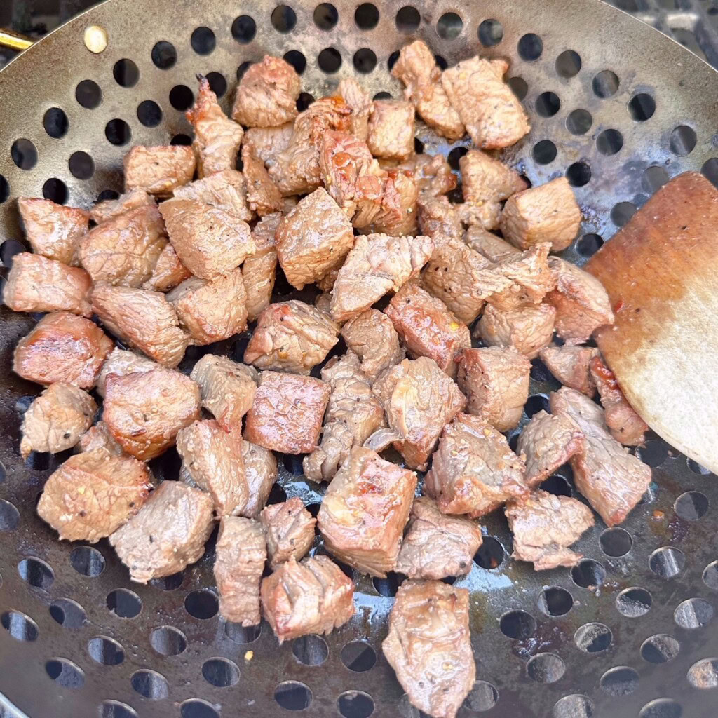 Teriyaki beef cooked in the grilling basket.
