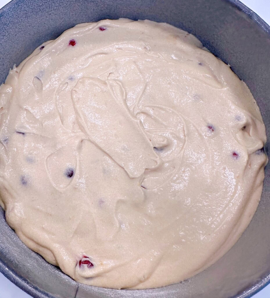 Spreading the cake batter in a spring form pan.