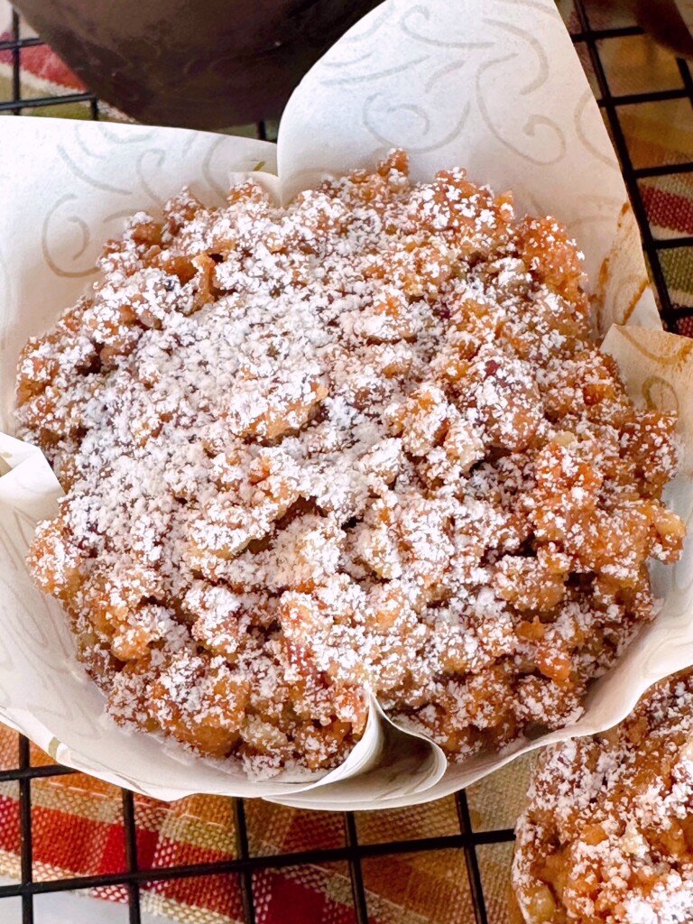 Up close overhead photo of muffins with streusel toppings.